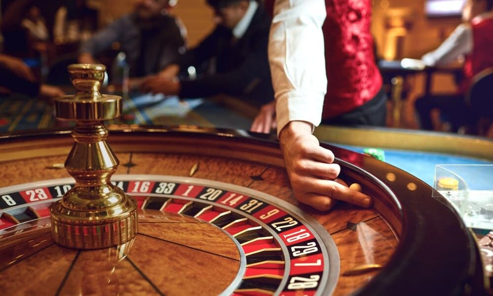 Casino Representation lawyers for Ocean Springs Biloxi Mississippi portrayed by roulette wheel in a casino in Mississippi.